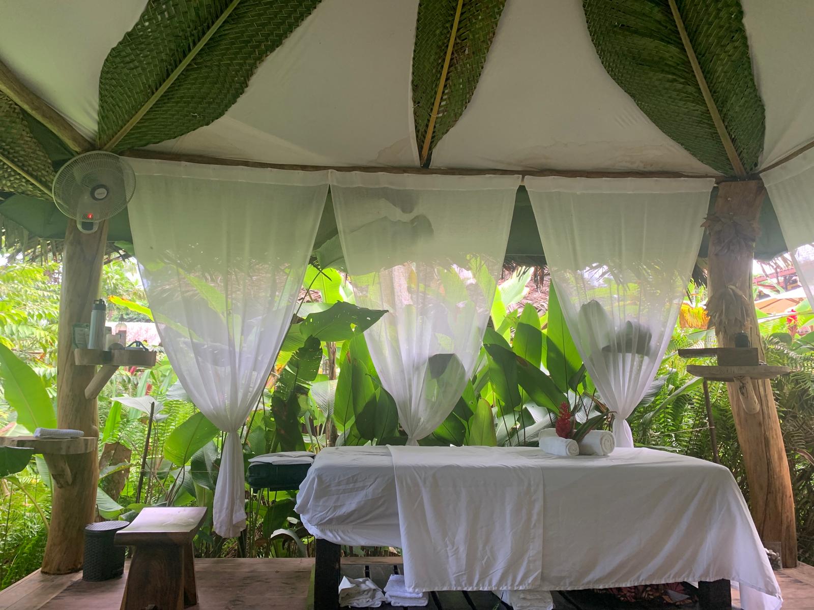 Thatched-roof spa cabana at Bluff Beach Jungle Spa
